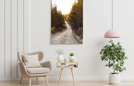 Poster mockup with vertical frames on empty white wall in living